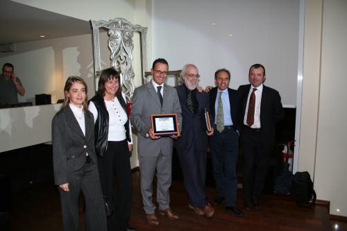 Foto di gruppo. Accanto al Presidente del Consiglio, il grafico Massimo Fredda, curatore del progetto